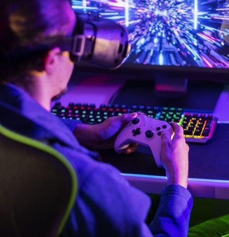 gamer-playing-with-controller-side-view (1)